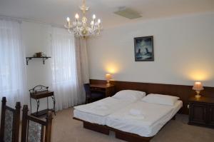 Ein Bett oder Betten in einem Zimmer der Unterkunft Hotel Petr
