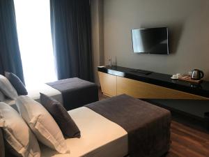 Postel nebo postele na pokoji v ubytování Supreme Hotel