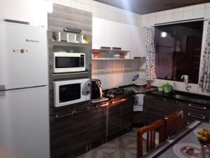 Kuchyň nebo kuchyňský kout v ubytování Pousada Residencial Caroa