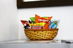 a basket of chips and snacks on a counter at Hotel Royal Suite in Manizales