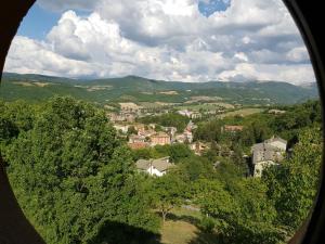 an aerial view of a town with trees and houses at La Colombaia in Cascia