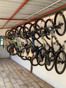 a group of bikes hanging on a wall at Palm garden Resort in Gisenyi