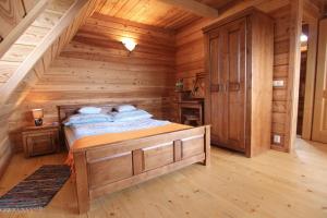 Posteľ alebo postele v izbe v ubytovaní Domek Koziniec Zakopane