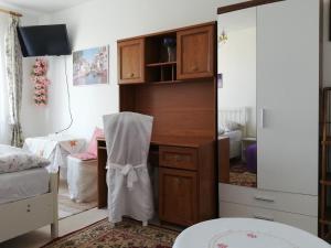 a bedroom with a dresser and a mirror at Apartments Meixner in Mariánské Lázně