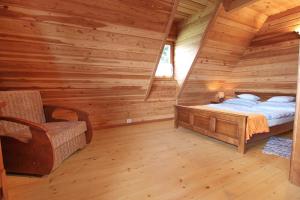 Posteľ alebo postele v izbe v ubytovaní Domek Koziniec Zakopane