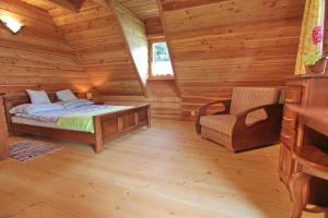 Posteľ alebo postele v izbe v ubytovaní Domek Koziniec Zakopane