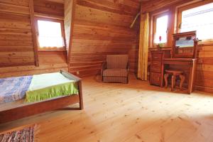 Posteľ alebo postele v izbe v ubytovaní Domek Koziniec Zakopane