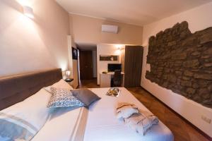 Posteľ alebo postele v izbe v ubytovaní Le Undici Rose Hotel