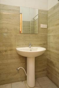 Koupelna v ubytování Birunthavanam