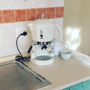 Kuchyň nebo kuchyňský kout v ubytování Villa L'Ottagono con cucina parcheggio privato telecamerizzato e wifi
