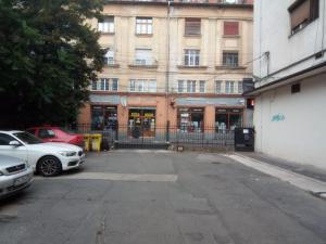 a parking lot with cars parked in front of a building at Ultracentral apartment bulevard regele mihai nr 10, sc a ap 16 in Timişoara
