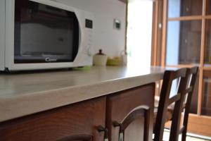 a kitchen counter with a microwave on top of it at Varazze Sea Mountain 2 in Varazze