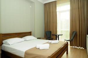 Voodi või voodid majutusasutuse Family Hotel Chino toas