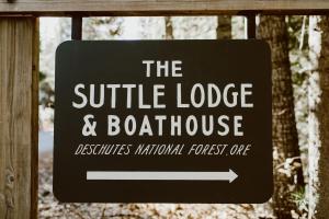 a sign for the wildlife lodge and boathouse at The Suttle Lodge & Boathouse in Camp Sherman