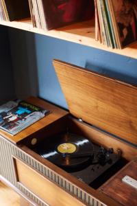 a record cabinet with a vinyl record in it at The Suttle Lodge & Boathouse in Camp Sherman