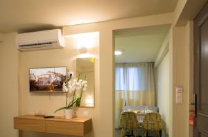 A television and/or entertainment centre at Athena hotel