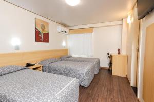 Postel nebo postele na pokoji v ubytování Hotel Express Terminal Tur - Rodoviária Porto Alegre