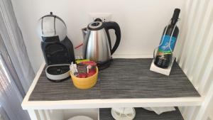 a counter top with a coffee maker and a blender at Suite Lia - Private Room with garden and tub close to Villa Eva e Cimbrone, Ravello in Ravello