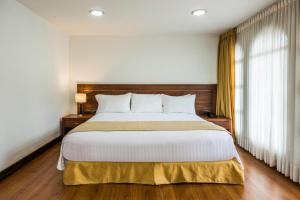 Postel nebo postele na pokoji v ubytování Hotel Portales Del Campestre