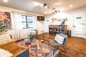 a living room with a couch and a table at Stonewall Motor Lodge in Stonewall