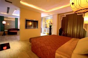 TV a/nebo společenská místnost v ubytování Chateau Motel & Spa