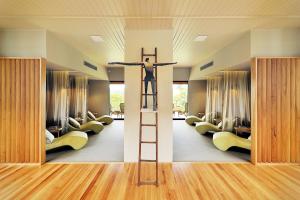 a room with a cross on the top of a ladder at Spicers Tamarind Retreat & Spa in Maleny