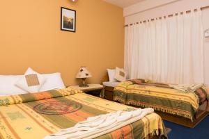 Postel nebo postele na pokoji v ubytování Peace Eye Guest House