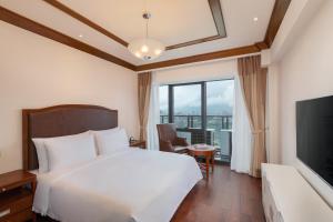 Katil atau katil-katil dalam bilik di Kantharyar Serviced Apartment