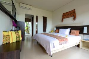 A bed or beds in a room at Villa Karingal