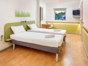 Postel nebo postele na pokoji v ubytování ibis budget Southampton Centre