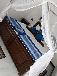 Voodi või voodid majutusasutuse The Wave's Guest House toas