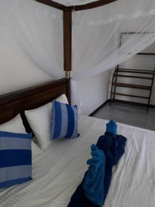 Voodi või voodid majutusasutuse The Wave's Guest House toas