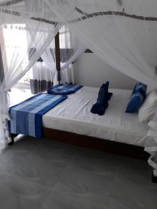 Voodi või voodid majutusasutuse The Wave's Guest House toas