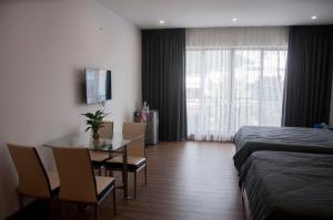 Postel nebo postele na pokoji v ubytování Nếp Apartment Hotel