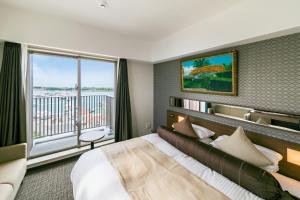 Postel nebo postele na pokoji v ubytování Hotel Miyahira 