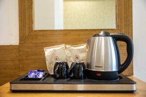 Příslušenství pro přípravu čaje a kávy v ubytování Hotel Grace Galaxy