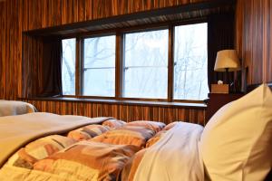 Postel nebo postele na pokoji v ubytování Forest Inn Sangoro