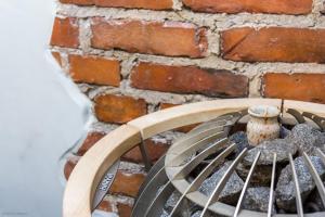 a metal grate next to a brick wall at 2ndhomes Luxury Helsinki City 2BR Penthouse w/Sauna in Helsinki