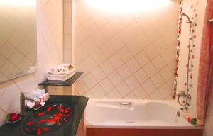 a small bathroom with a sink and a mirror at Baan Boa Resort in Patong Beach