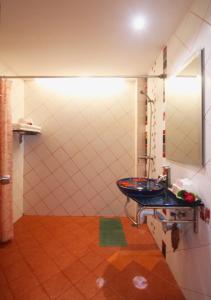 a bathroom with a sink and a shower at Baan Boa Resort in Patong Beach