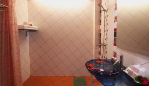 a bathroom with a shower with a toilet and a sink at Baan Boa Resort in Patong Beach