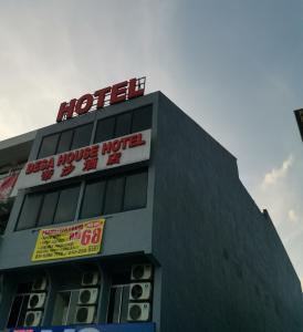 a building with a hotel sign on top of it at Desa house hotel in Kampong Kepong