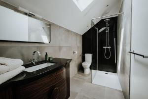 a bathroom with a sink and a shower at Le Clos de la Pomponnette in Pomponne +38 photos