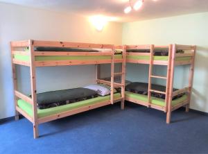 two bunk beds are in a room with at Ferienhaus Stefania in Tösens