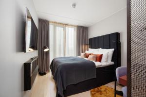 Postel nebo postele na pokoji v ubytování Clarion Hotel Oslo