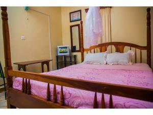 Postel nebo postele na pokoji v ubytování Merona Hotel