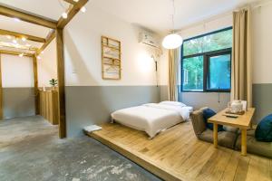 Postel nebo postele na pokoji v ubytování HOME++ Xi'an