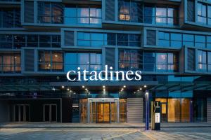 a facade of a building with the sign for certificates at Citadines Keqiao Shaoxing in Shaoxing
