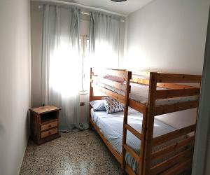 Postel nebo postele na pokoji v ubytování Piso Familiar en Llançà