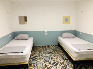 Postel nebo postele na pokoji v ubytování Buff Hostel Tirana